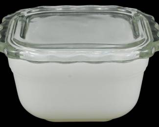 1126 - Vtg Fire King Refrigerator Box w/ Lid (Description): Vintage Fire King refrigerator box with clear  glass lid. The dish features a white milk  glass body with a square shape and the lid  has decorative scalloped tab handles on the  corners. Measures 3 inches by 5 inches by 5 inches.
