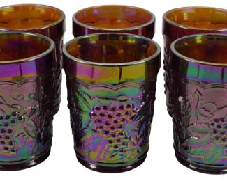 725 - 6 Imperial Marigold Grape & Cable Tumblers (Description): Set of six vintage Imperial Marigold Grape &  Cable carnival glass tumblers. These  beautiful iridescent glasses feature the  classic grape and cable pattern with raised  grape clusters and vine motifs. The exterior displays rich purple, green, and gold  carnival glass coloring with an amber-toned  interior. Each tumbler measures 4 inches  tall.