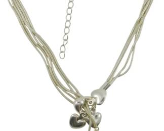 813 - Sterling Silver Heart Charm Bracelet (Description): Sterling silver bracelet featuring multiple  delicate snake chains gathered together with  dangling puffed heart charms. The bracelet  has a lobster claw clasp with an extender  chain for adjustable fit. Weight: 0.59 oz.