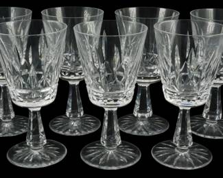 641 - 7 Waterford Rosslare Water Goblets 7" (Description): A set of seven Waterford crystal stemware  glasses. Each stem measures 7 inches in  height. The glasses feature the  characteristic Waterford cut crystal pattern  with elegant faceted stems and round bases.