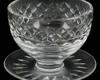905 - Waterford Crystal Dessert Bowl 3"x4" (Description): Waterford Crystal dessert bowl featuring a  classic diamond cut pattern on the bowl  portion with a footed pedestal base. The  circular foot displays an elegant starburst  cut design. This piece exemplifies Waterford's renowned craftsmanship in fine  crystal. Measures 3 inches tall by 4 inches  in diameter.
