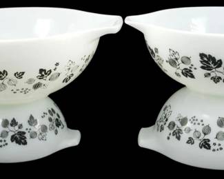 1209 - Pyrex Black Gooseberry 4pc Mixing Bowl Set (Description): Pyrex Black Gooseberry 4-piece mixing bowl  set featuring the classic Cinderella style  with pour spouts and tab handles. The white  milk glass bowls are decorated with the  distinctive black gooseberry pattern depicting leaves, berries, and florals. This  nesting set includes four graduated sizes.  Measures 4.5" x 13" x 10.5".