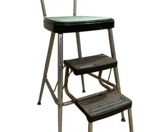 7622 - Vintage Cosco Style Step Stool Chair (Description): Vintage step stool chair in the style of  Cosco, featuring a turquoise green vinyl seat  and backrest with chrome-plated tubular  steel frame. The chair includes two pull-out  steps in black with a retractable design. Shows wear consistent with age and use,  including some surface scratching and patina  on the metal components. Measures 34 inches  high by 14 inches wide by 23 inches deep.