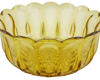 751 - Vtg Anchor Hocking Amber Glass Bowl 4"x9" (Description): Vintage Anchor Hocking amber glass bowl  featuring a scalloped rim and distinctive  petal-like paneled design. The rich golden  amber coloring graduates from deeper tones at  the base to lighter hues near the rim. Measures 4 inches tall by 9 inches in  diameter.