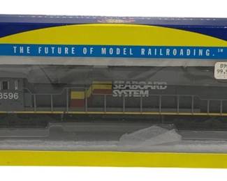 1599 - Athearn Seaboard System HO Locomotive #8596 (Description): Athearn HO scale Seaboard System locomotive,  road number 8596. This Ready to Roll model  features DCC Quick-Plug equipped capability.  The diesel locomotive comes in original blue  and yellow Athearn packaging. Part of Athearn's 'The Future of Model Railroading'  product line.