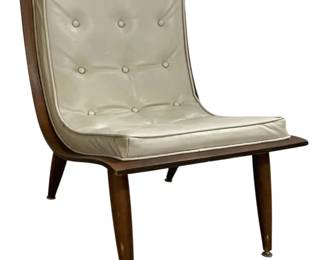 7608 - Carter Bros MCM Cream Scoop Lounge Chair (Description): Featuring a walnut frame with tapered legs  and chrome-capped feet. The chair is  upholstered in cream button-tufted vinyl or  leather with a coordinating seat cushion. The  low-profile armless design is characteristic of the era. Measures 29 inches high by 23  inches wide by 26 inches deep.