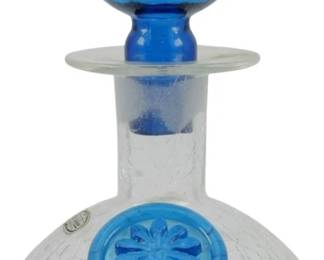 850 - Vintage Rainbow Crackle Glass Decanter 8" (Description): Vintage Rainbow crackle glass decanter  featuring a clear crackle glass body with a  blue glass ball stopper. The decanter is  adorned with an applied blue glass floral  medallion on the front. Measures 8 inches tall.
