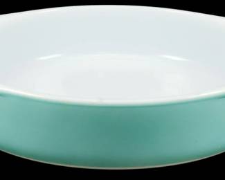 1197 - Pyrex Turquoise Oval Casserole 2"x10"x9" (Description): Pyrex turquoise oval casserole dish featuring  the classic mid-century turquoise exterior  with white opal interior. This vintage baking  dish has tab handles on each end for easy  handling. Measures 2 inches high by 10 inches long by 9 inches wide.