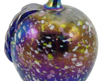 695 - Vintage Gibson Art Glass Paperweight 4" (Description): Vintage Gibson Art Glass paperweight in the  form of an apple. Features a speckled  iridescent surface with purple, gold, pink,  white, and yellow tones throughout. The stem  and leaf display a striking blue iridescent finish. Measures 4 inches.