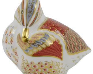 804 - Royal Crown Derby Teal Duckling Paperweight (Description): Royal Crown Derby Teal Duckling paperweight  featuring the iconic Imari-style decoration  in rich red, gold, blue, and cream tones. The  duckling displays intricate hand-painted  patterns including feather detailing and geometric designs characteristic of Royal  Crown Derby's fine bone china pieces. This  paperweight does not include the gold  stopper. Measures 2.5 inches.