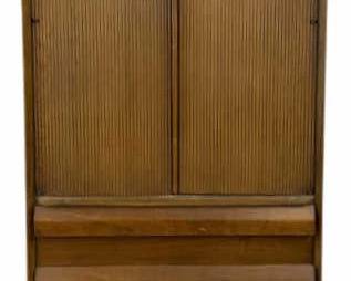 7507 - MCM Lane First Edition Gentlemen's Chest (Description): Mid-Century gentlemen's chest featuring a  walnut finish with distinctive tambour  sliding doors on the upper cabinet section.  The lower portion has three graduated drawers  with angled front faces creating a sculptural effect. The piece rests on tapered  splayed legs characteristic of the era.  Measures 69 inches tall by 32 inches wide by  18 inches deep.