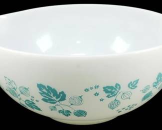 1205 - Pyrex Turquoise Gooseberry Mixing Bowl (Description): Pyrex Turquoise Gooseberry mixing bowl  featuring the classic white opal glass with  turquoise printed gooseberry and leaf design.  This Cinderella-style bowl includes the  signature pour spouts on each side. Measures 4 inches high by 11 inches wide by9 inches  deep.