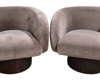 1402 - Pr Union Home Rotunda Swivel Chairs (Description): Retails $1076 each. These contemporary lounge  chairs feature a curved barrel-back design  with rounded arms and rest on circular swivel  bases. Measurements: 30" x 36" x 32".