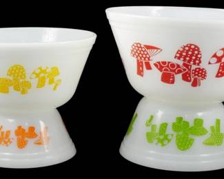 1030 - Vtg Federal 4pc Mushroom Bowl Set 4"x8" (Description): Vintage Federal 4-piece mushroom bowl set  featuring white milk glass construction with  colorful mushroom motifs. The set includes  two bowls and two pedestals decorated in  vibrant yellow, orange, red, and green mushroom designs characteristic of 1970s  kitchenware. Measures 4" x 8".