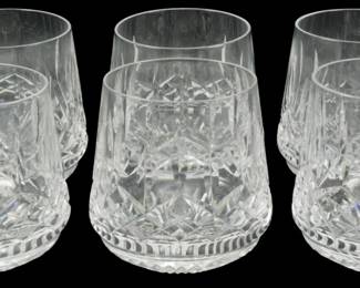 918 - 6 Waterford Crystal Lismore Tumblers (Description): Set of six Waterford Crystal Lismore Roly  Poly Old Fashioned tumblers. These elegant  glasses feature the iconic Lismore pattern  with its distinctive diamond and wedge cuts  that create brilliant light refraction. The rounded, barrel-shaped design is  characteristic of the roly poly style. Each  tumbler measures 3 inches.