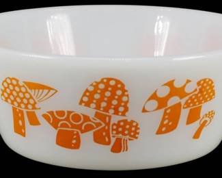 1183 - Vtg Federal Small Orange Mushroom Bowl (Description): Vintage Federal small bowl featuring a  charming orange mushroom pattern on white  milk glass. The whimsical design showcases  various mushrooms with polka dots and  decorative patterns in a retro 1970s style that wraps around the exterior of the  bowl.Measures 2 inches tall by 5 inches in  diameter.