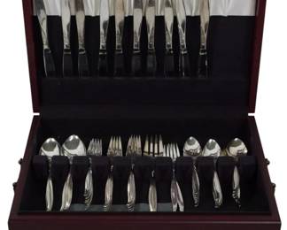 957 - 68pc Set Mid-Century Oneida Winsome Flatware w/Box (Description): A set of Oneida Community silverplate  flatware housed in a mahogany-finished wooden  storage chest. The chest features a hinged  lid with a brass nameplate and a pull-out  drawer with brass knobs for additional storage. Storage box measures 20 inches by 16  inches by 12 inches.