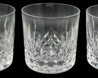 915 - 3 Waterford Crystal Whiskey Glasses 3.5" (Description): Three Waterford crystal whiskey glasses  featuring the classic Lismore pattern. Each  glass showcases the signature diamond and  wedge cut design with vertical cuts rising  toward the rim. The heavy cut crystal catches and refracts light beautifully. Each glass  measures 3.5 inches in height.
