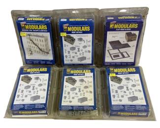 1677 - 6pc Cornerstone HO Modulars Model Train Kits (Description): Six-piece lot of Walthers Cornerstone HO  Modulars model train building kits. The  assortment includes a Modern Fire Escape &  Details set, multiple Roof Details kits, and  a Flat Roof & Base kit. All kits are in their original sealed clamshell packaging and are  designed for HO scale model railroad layouts.
