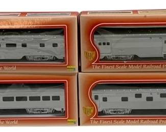 1623 - IHC Southern 4pc HO Scale Train Car Set (Description): IHC "Southern" four-piece train car set in HO  scale. The set includes four silver  passenger cars with "Southern" railway  markings, each housed in its original orange  IHC branded box. The boxes feature "The Finest Scale Model Railroad Products for  round the World" tagline. The cars appear to  represent classic streamlined passenger  equipment in the Southern Railway livery.