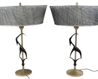 945 - Pair Rembrandt Antelope Gazelle Table Lamps (Description): Pair of Mid Century Modern table lamps by  Rembrandt  featuring stylized black gazelle  or antelope figures spiraling around a  brass-toned central pole. The lamps have  round gold-tone metal bases and brass torchiere-style sockets topped with white  milk glass shade supports and original atomic  lampshades. Each lamp measures 24 inches  tall. Used as is electric/electronic/mechanical