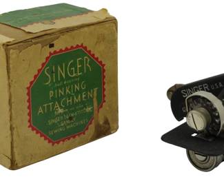 881 - Singer Ball Bearing Pinking Attachment w Box (Description): Vintage Singer ball bearing pinking  attachment with original box. The attachment  features a black and silver metal  construction marked "Singer U.S.A." and  includes the original cardboard box with green and red Singer branding. The box  indicates its designed for use on Singer  lock-stitch family sewing machines and notes  that it is easily attached and operated. Used as is electric/electronic/mechanical