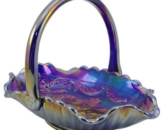 710 - Vtg Fenton Cobalt Blue Carnival Glass Basket (Description): Vintage Fenton Cobalt Blue American Beauty  Rose Carnival Glass Basket. This striking  piece features the American Beauty Rose  pattern with a distinctive iridescent finish  that displays brilliant purple, blue, gold, and pink hues. The basket has a gracefully  ruffled crimped edge, fixed loop handle, and  swirled ribbed exterior. Measures 6 inches by  8 inches by 5.5 inches.