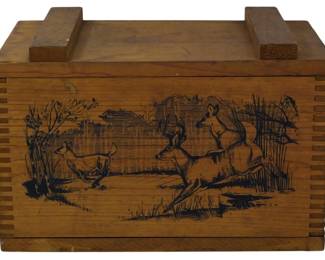 955 - Vintage Wooden Crate w/ Deer Scene 10"x16"x9" (Description): Vintage wooden crate featuring a decorative  deer scene on the front panel. The box  displays detailed imagery of deer in a  natural woodland setting. Constructed with  finger joint corners and a removable lid with raised handles. The warm honey-toned wood  showcases quality craftsmanship typical of  ammunition or storage crates. Measures 10" x  16" x 9".