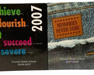 1564 - 2pc Tunstall Middle School Yearbooks 2006-08 (Description): Two Tunstall Middle School yearbooks spanning  consecutive school years. The first yearbook  covers 2006-2007 and features a black cover  with colorful motivational words including  "achieve," "flourish," and "succeed." The second yearbook covers 2008 and displays a  denim-style cover with a leather patch  reading "Memories Never Fade."