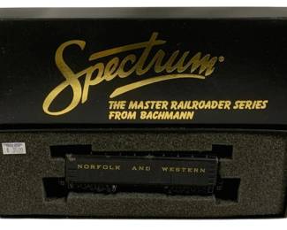 1583 - Bachmann Spectrum DCC HO Norfolk Western Car (Description): Bachmann Spectrum Master Railroader Series  DCC on Board HO scale water tender car. The  model features Norfolk and Western railroad  livery in black. Comes in original Spectrum  packaging with foam insert.