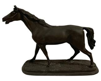 1534 - Metal Horse Statue 15"x11"x4.5" (Description): Metal horse statue featuring a trotting horse  with flowing mane and tail, mounted on an  oval base. The figure displays a dark  bronze-like patina finish with finely  detailed musculature and realistic equine form. Measures 15 inches long by 11 inches  tall by 4.5 inches wide.
