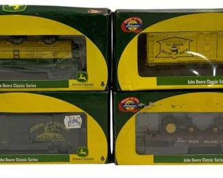 1627 - Athearn 4pc John Deere Train Cars (Description): Athearn four-piece set of John Deere Classic  Series train cars. The collection includes  various freight car types in the distinctive  John Deere green and yellow color scheme,  featuring boxcars, a tank car, and a flatcar with tractor load. All cars are presented in  their original Ready to Roll packaging with  John Deere branding.