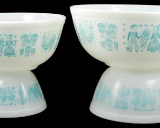 1032 - Vtg Pyrex Butterprint 4pc Mixing Bowl Set (Description): Vintage Pyrex Butterprint four-piece mixing  bowl set in the classic turquoise on white  colorway. The set features the iconic Amish  farmer and wife pattern with roosters, corn,  and other folk motifs. The bowls nest together for convenient storage. Measures 4.5  inches by 10.5 inches.