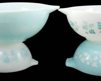 1186 - Pyrex Turquoise Gooseberry 4pc Bowl Set (Description): Pyrex Turquoise Gooseberry 4-piece Cinderella  mixing bowl set featuring the classic  gooseberry pattern in turquoise and white.  The set includes graduated nesting bowls with  the signature Cinderella pour spouts and tab handles. Two bowls feature theturquoise on  white colorway, while two display the reverse  white on turquoise pattern. Measures 4.5" x  13" x 10".