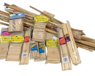 1705 - Lot Assorted Wood Dowels & Craft Sticks (Description): A large assortment of wood dowels and craft  supplies. The lot includes multiple packages  of Krafter's Korner wood poles in various  sizes, packages of wooden craft sticks, and  loose wood dowels and sticks of varying lengths and thicknesses. Ideal for crafting,  modeling, and DIY projects.