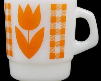 1170 - Vtg Termocrisa Tulip Mug 3.5" (Description): Vintage Termocrisa tulip mug in white milk  glass featuring a bold orange tulip design  with decorative orange gingham-style  checkered borders on either side. This  charming mid-century style mug showcases the classic stackable shape typical of the era.  Measures 3.5 inches tall.