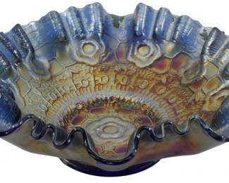 687 - Fenton Cobalt Blue Captive Rose Carnival Bowl (Description): Vintage Fenton Cobalt Blue Captive Rose  carnival glass bowl featuring an intricate  pressed pattern with a central rosette  medallion surrounded by decorative floral and  geometric designs. The bowl displays a beautiful iridescent finish with rich purple,  gold, and blue hues characteristic of  quality carnival glass. The ruffled edge adds  elegant dimension to this classic piece.  Measures 3 inches tall by 8 inches in