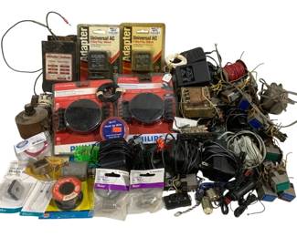 1658 - Lot Assorted Electronic Accessories & Parts (Description): A large assortment of electronic accessories  and parts including universal AC adapters,  AC/DC adapters, transformers, hook-up wire  spools, DC motors, bridge rectifiers, solder,  various power supplies, coils, capacitors, switches, cables, and miscellaneous  electrical components. Many items appear to  be new in original packaging while others are  loose components suitable for hobbyists,  repair work, or electronics projects.
