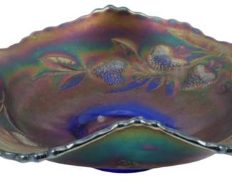 715 - Fenton Cobalt Blue Strawberry Carnival Dish (Description): Vintage Fenton cobalt blue carnival glass  candy dish featuring an embossed strawberry  vine pattern. The dish displays a rich  iridescent finish with multicolored  highlights typical of carnival glass. Features a ruffled scalloped edge and two  applied cobalt blue handles. Measures 2 1/2  inches tall by 7 inches wide.