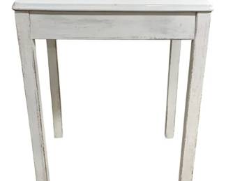 7686 - White Painted Wood Side Table 30"x24"x20" (Description): White painted wood side table with a simple,  clean-lined design. The table features a  square top, straight apron, and four tapered  legs. The painted finish shows a gently  distressed, weathered appearance consistent with farmhouse or cottage style. Measures 30  inches high by 24 inches wide by 20 inches  deep.