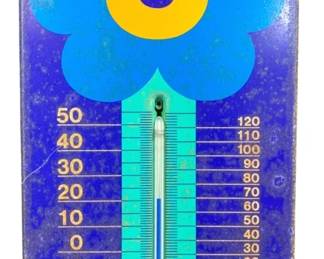 2008 - 1970s Laurids Lonborg Flower Power Thermometer (Description): Vintage metal thermometer featuring a bold  mod-style flower design in blue, turquoise,  yellow, and orange against a cobalt blue  background. The thermometer displays both  Celsius and Fahrenheit scales, with the glass tube set into a turquoise stem extending  from the flower. Evocative of 1960s-1970s pop  art decor. Measures 6" x 11".