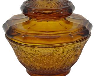 1069 - Vtg Indiana Amber Tiara Sandwich Biscuit Jar (Description): Vintage Indiana Amber Tiara Sandwich biscuit  jar featuring the classic pressed glass  pattern with floral medallions and stippled  hobnail texture on the bowl. The matching lid  displays an ornate raised floral design. Measures 5 inches by 5 inches.