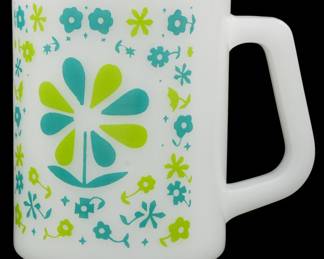 1172 - Vtg Federal Blue & Green Floral Milk Glass (Description): Vintage Federal milk glass mug featuring a  charming blue and green floral pattern. The  design showcases a large central daisy flower  surrounded by smaller flowers, leaves, and  decorative motifs in turquoise and lime green. The mug has a distinctiveD-shaped  handle characteristic of Federal Glass  production. Measures 3.5" tall.