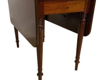 7668 - Antique Cherry Drop Leaf Table 24"x37"x47" (Description): Antique drop leaf table crafted in cherry  wood with a warm, rich finish. The table  features elegant turned and tapered legs with  ring turnings, characteristic of Sheraton or  Federal period styling. The design includes a single drawer in the apron and two drop  leaves that extend the surface when raised.  Measures 24 inches by 37 inches by 47 inches  with leaves extended.