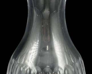 1237 - Waterford Crystal Carafe 5.5" (Description): Waterford Crystal carafe featuring an elegant  bulbous body with vertical cut crystal  detailing at the base that transitions to a  smooth, clear upper portion with a gracefully  flared rim. The piece showcases Waterford's signature quality crystal craftsmanship.  Measures 5.5 inches in height.