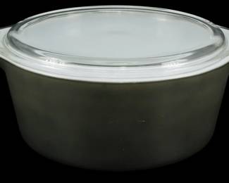 1200 - Pyrex Pueblo Bake N Carry w/ Lid 4"x11"x9" (Description): Pyrex Pueblo Bake N Carry casserole dish with  original clear glass lid. The dish features  the classic olive green/brown exterior  characteristic of the Pueblo pattern, with a  white opal interior. Complete with tab handles on each side for easy carrying.  Measures 4 inches tall by 11 inches wide by 9  inches deep.