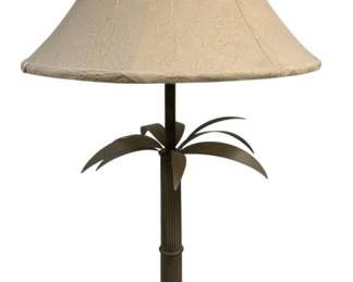 2000 - Metal Palm Tree Table Lamp w/ Cream Shade 36" (Description): Decorative metal table lamp featuring a palm  tree design with radiating fronds beneath the  socket. The lamp has a reeded column shaft  and sits on an ornate square footed base with  shell and scroll motifs. Includes a cream-colored bell-shaped fabric shade with  subtle floral jacquard pattern. Measures 36  inches tall. Used as is  electric/electronic/mechanical item. No  guarantee all components present, untested.