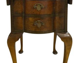 7765 - Queen Anne 3 Drawer Drop Leaf Side Table (Description): Queen Anne style three drawer drop leaf side  table featuring beautiful burl wood veneer on  the serpentine drawer fronts. The piece is  fitted with decorative brass hardware  including bail pulls and escutcheons. It stands on elegant cabriole legs ending in pad  feet. Measures 27 inches high by 26 inches  wide by 15 inches deep.