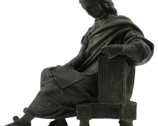 597 - Spelter Seated Male Figure, Possibly Moliere (Description): A spelter figure depicting a seated male,  possibly Moliere. The figure is shown in a  contemplative pose, seated on an ornate  chair. Measures 8 inches tall.