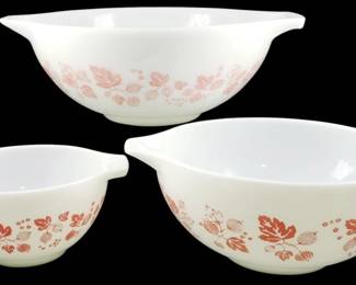 1193 - Rigopal Horno Pink Gooseberry Mixing Bowls (Description): Set of three Rigopal Horno Pink Gooseberry  mixing bowls in graduated sizes. The white  milk glass bowls feature a charming pink  gooseberry and leaf pattern around the  exterior. Each bowl has the characteristic Cinderella-style tab handles on either side.  Largest bowl measures 4.5 inches tall by 13  inches in diameter.
